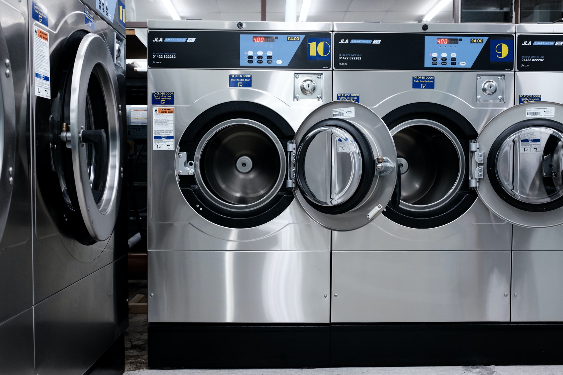 grey washing machine in laundry room